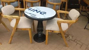 Round Table With a Morden Two Chairs