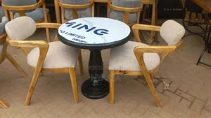 Round Table With a Morden Two Chairs