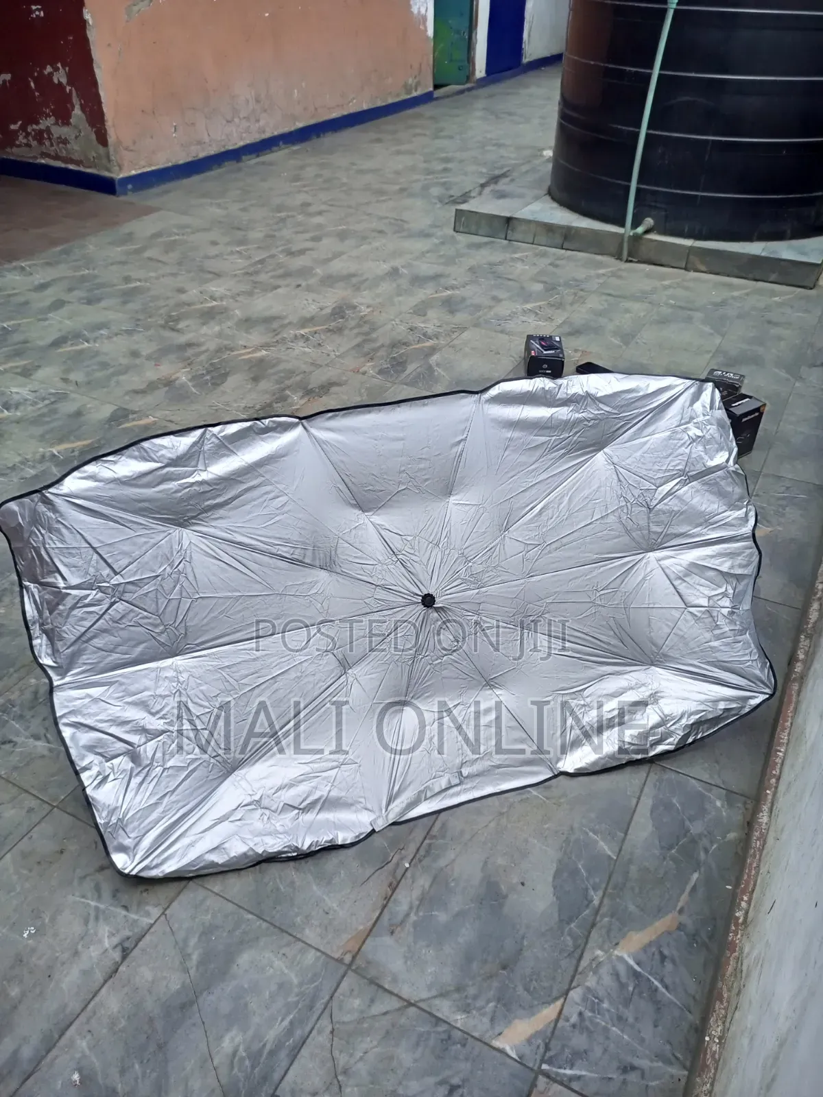 An Umbrella-Style Car Windshield Sunshade,