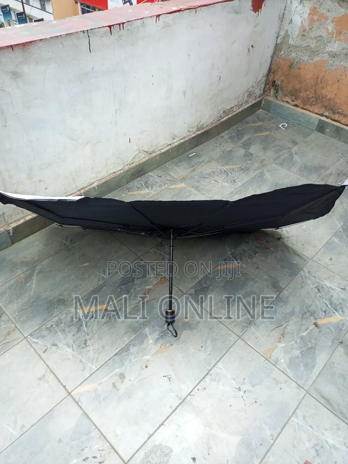 An Umbrella-Style Car Windshield Sunshade,