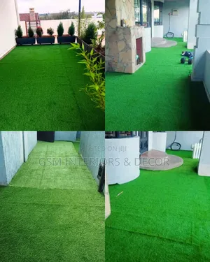 Artificial Green Grass Carpets Alongside Live Plants
