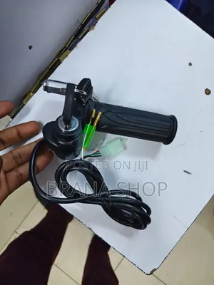 **Title:** Electric Twist Throttle Grip With Key Switch