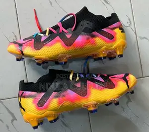 Vibrant Puma Future Ultimate Football Boots.