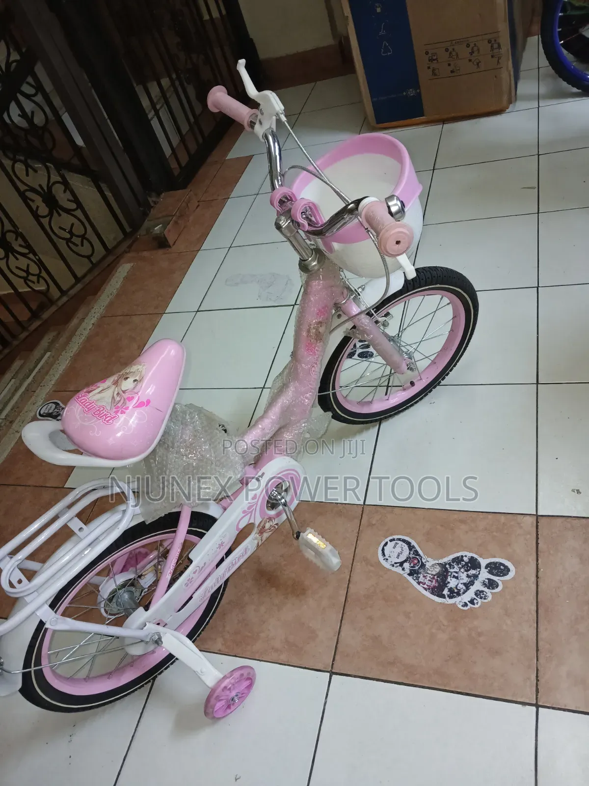 "Lady Bird" Style Bicycle Equipped With Training Wheels