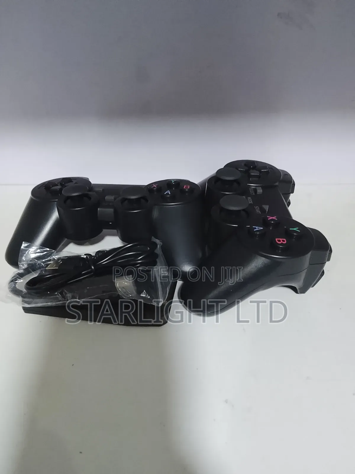 Retro Gaming on the Go: Dual-Controller Black Game Stick Setup