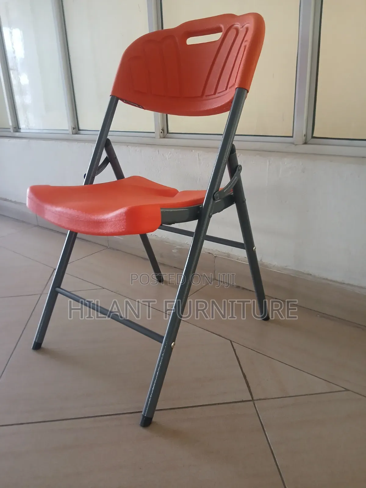 Elevate Plastic Orange Folding Chair