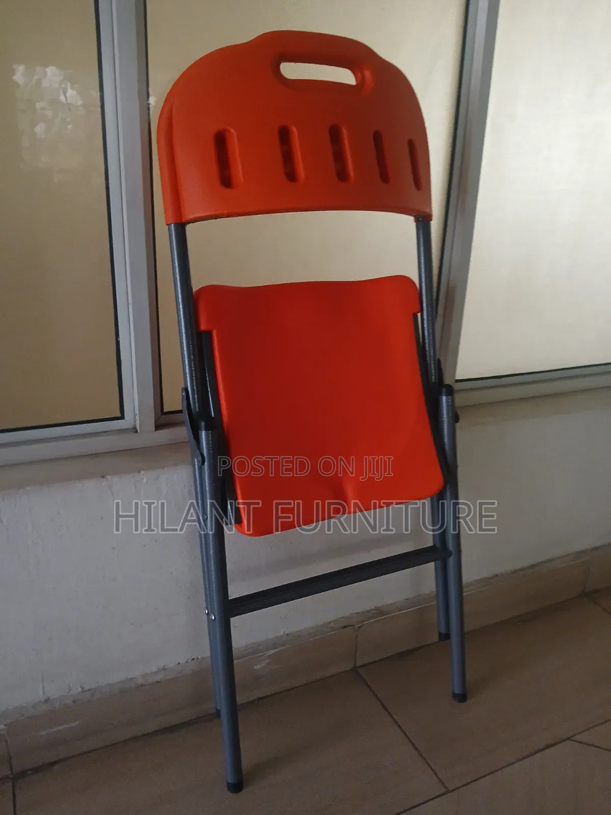 Elevate Plastic Orange Folding Chair