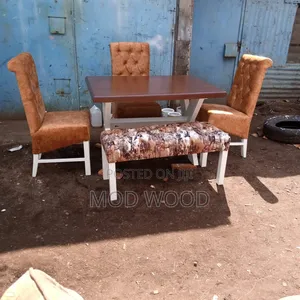 Modern Trestle Dining Set With Tufted Chairs and Patterned Bench