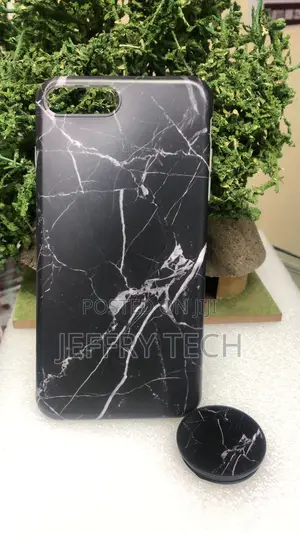 Black Marble-Patterned Phone Case With a Phone Grip for an iPhone 8.
