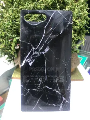 Square-Edged Smartphone Case Featuring a Black Marble iPhone 15 Pro