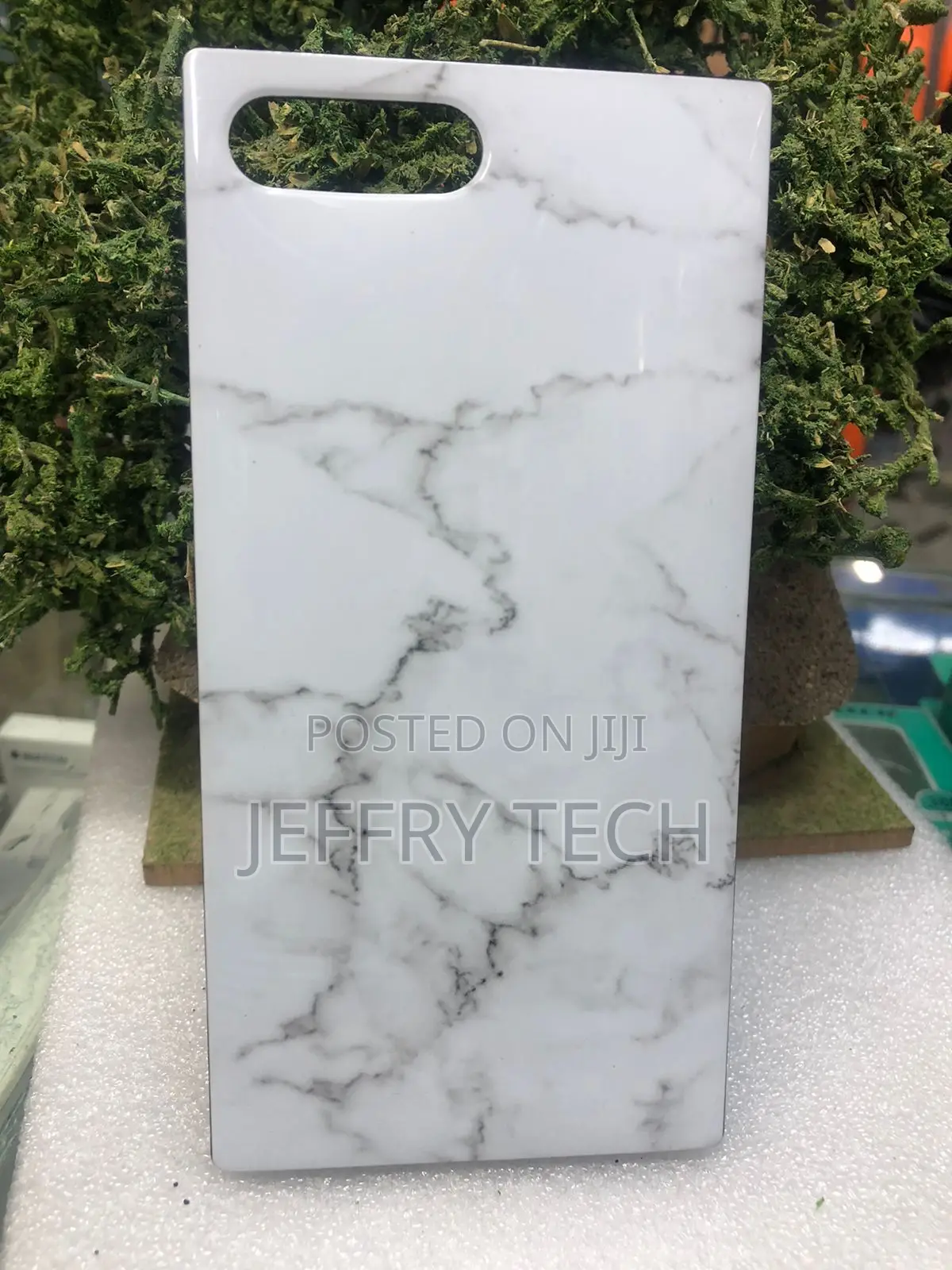Square-Edged Smartphone Case Featuring a Black Marble iPhone 15 Pro