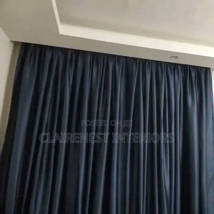 Dress Tall Windows With Elegant Flowing Curtains Fabrics.
