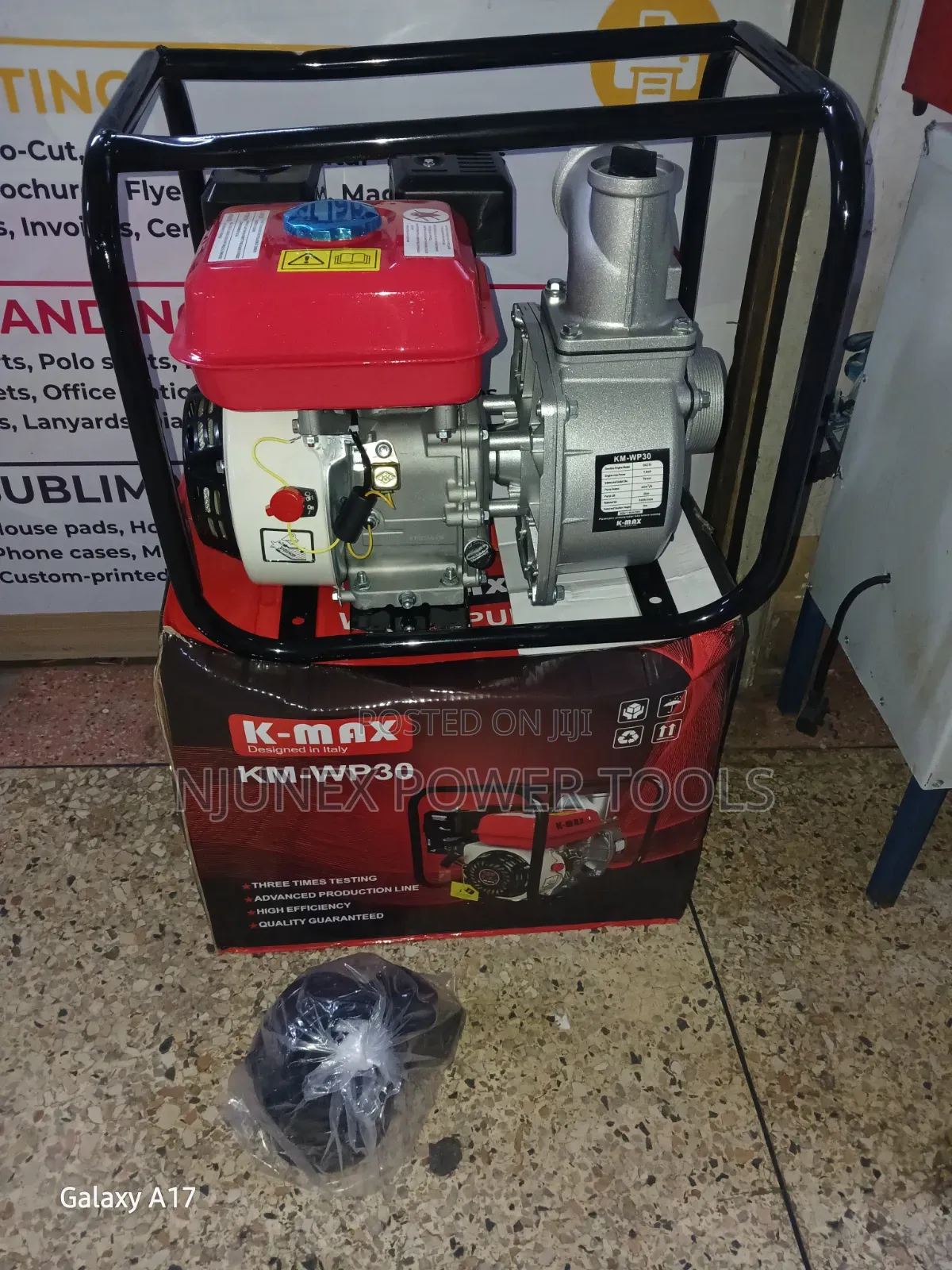 K-Max KM-WP30 Petrol-Powered Water Pump Sitting on Its Branded Box.