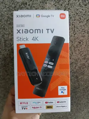Xiaomi TV Stick (2nd Gen) Device and Its Voice Remote Control.