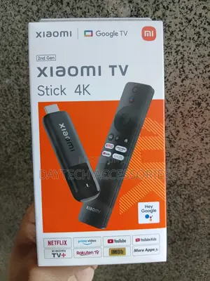Xiaomi TV Stick (2nd Gen) Device and Its Voice Remote Control.