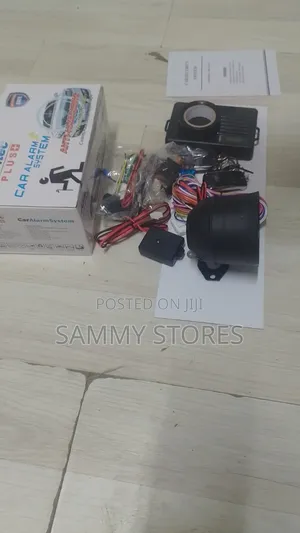 Universal Vehicle Alarm System With Dual-Stage Shock Sensor