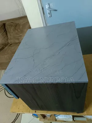 Elegant Blue and Grey Bedside Cabinet With Open Shelf and Drawer.