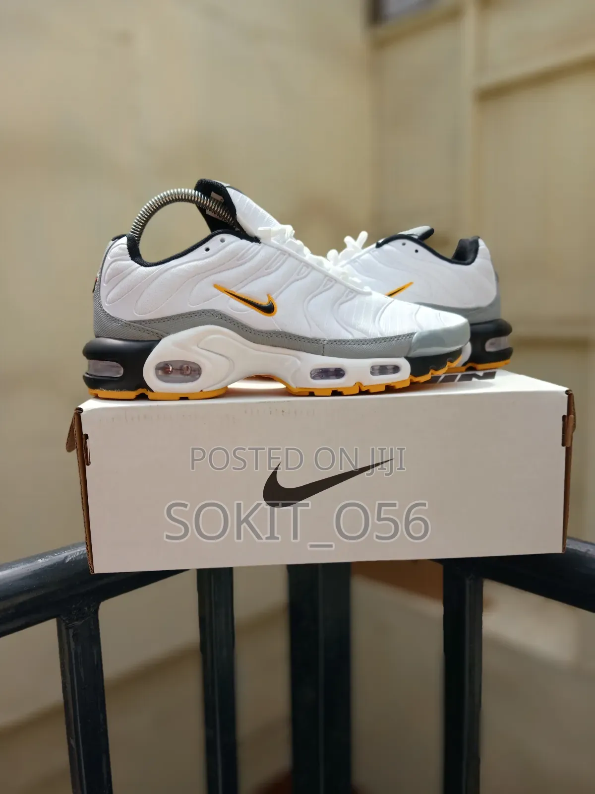 Nike Air Max Plus (TN) Sneakers With Orange and Black Accents