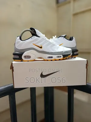 Nike Air Max Plus (TN) Sneakers With Orange and Black Accents
