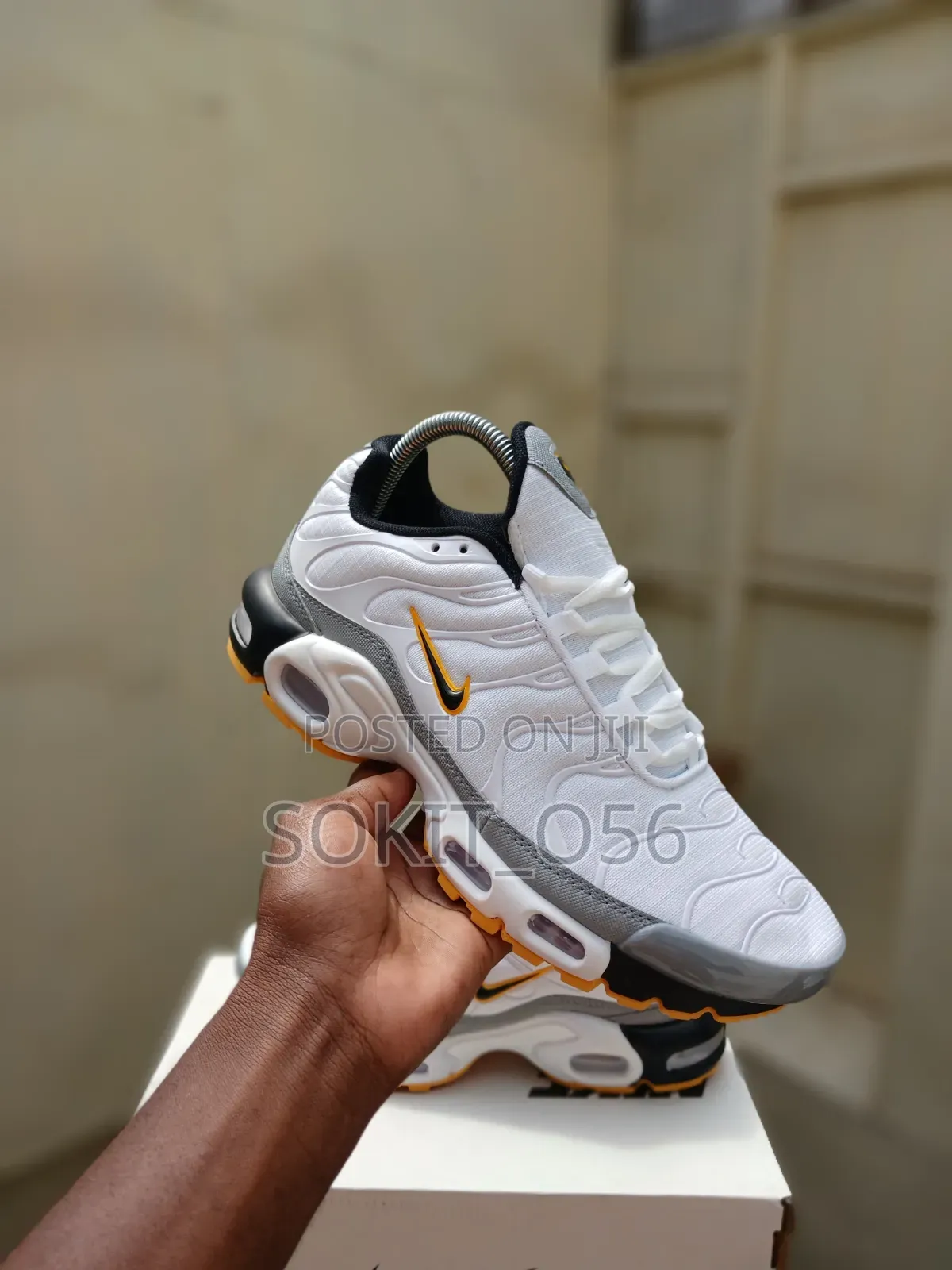 Nike Air Max Plus (TN) Sneakers With Orange and Black Accents