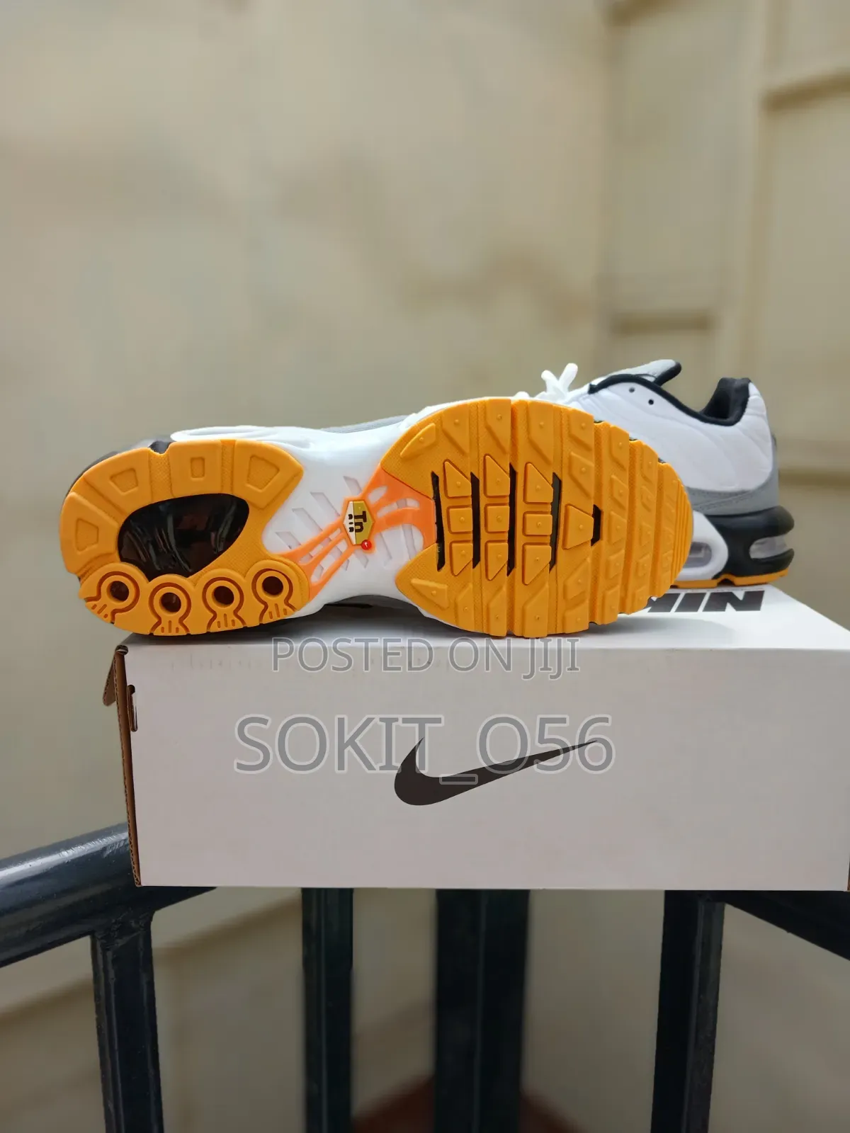 Nike Air Max Plus (TN) Sneakers With Orange and Black Accents