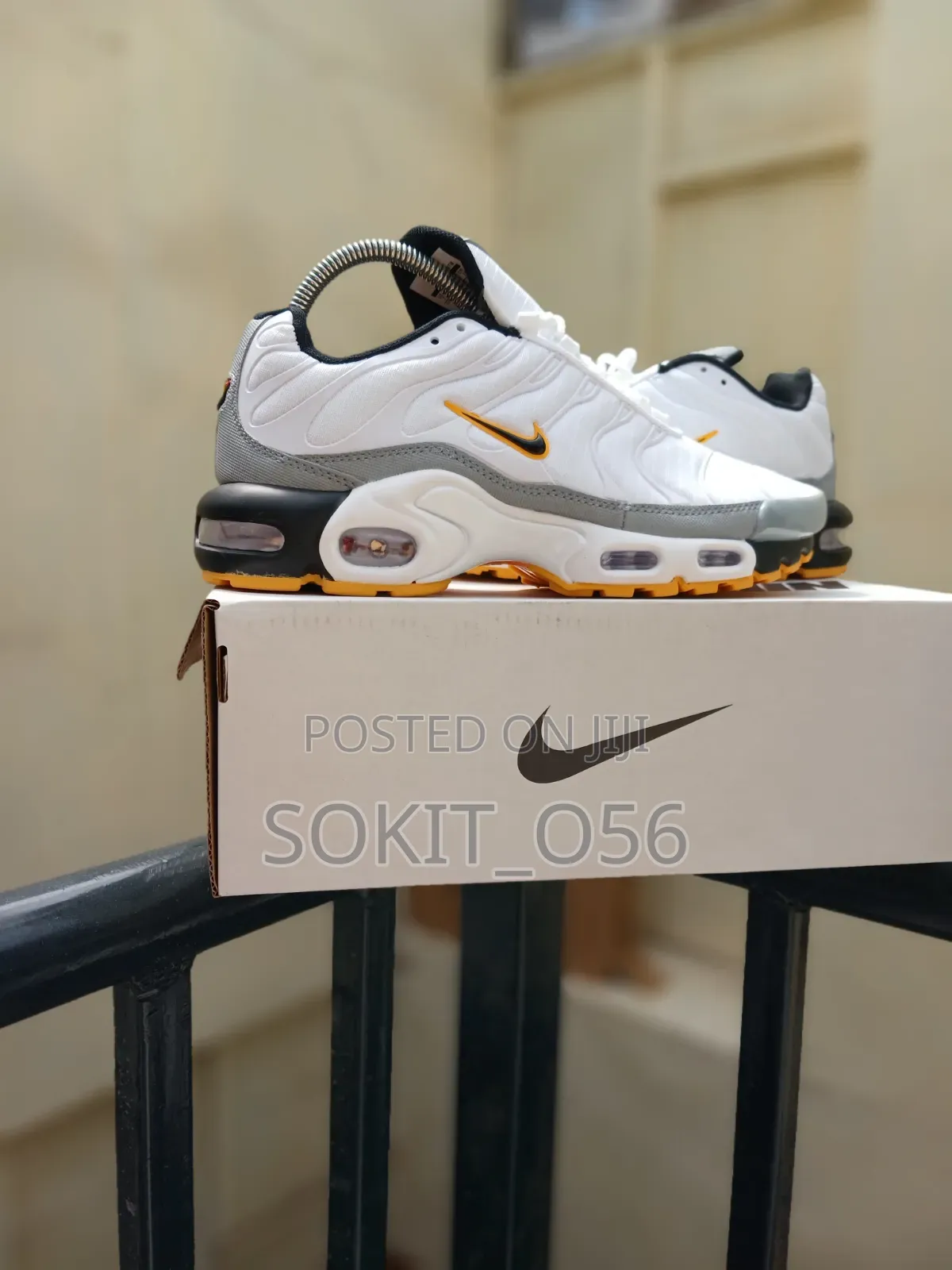 Nike Air Max Plus (TN) Sneakers With Orange and Black Accents