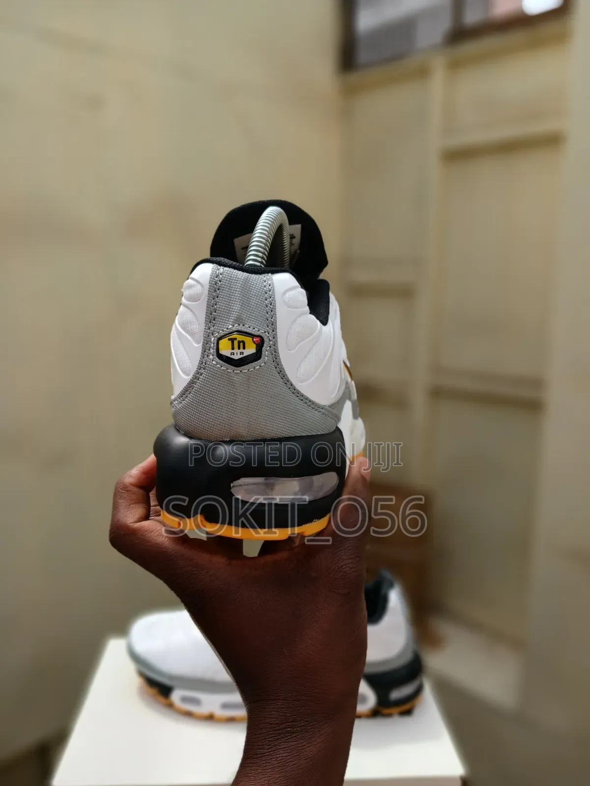 Nike Air Max Plus (TN) Sneakers With Orange and Black Accents