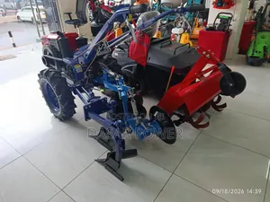 10hp Walking Tractor With Attachments.