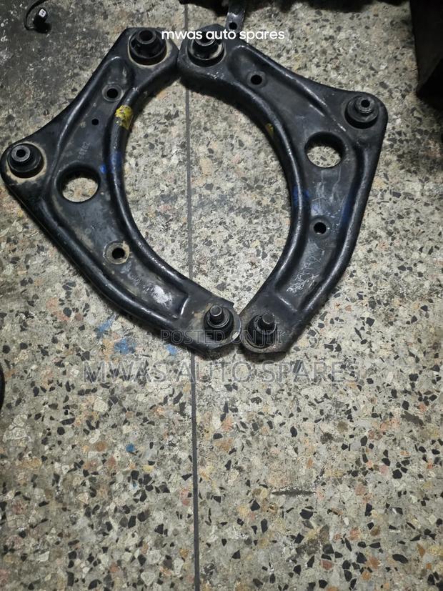 Nissnote E12 Control Arms - main view