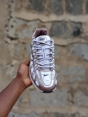The Nike P-6000 the White/Purple Dynasty/Light Violet Ore
