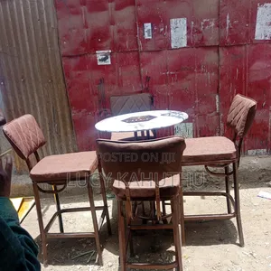 Brown High Stools Chairs and Kitamba Table