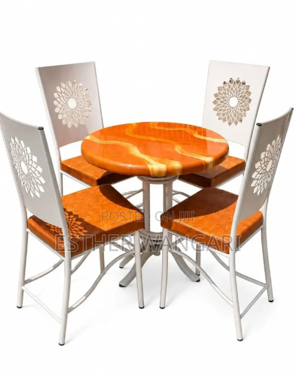 A Set of Four Brown Seats and a White Table