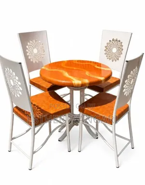 A Set of Four Brown Seats and a White Table