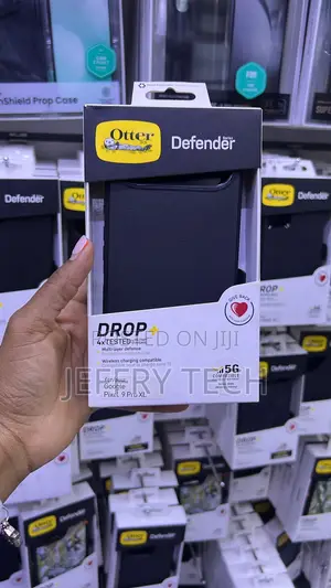 Black OtterBox Defender Series Case Packaged for the iPhone 17 Pro.