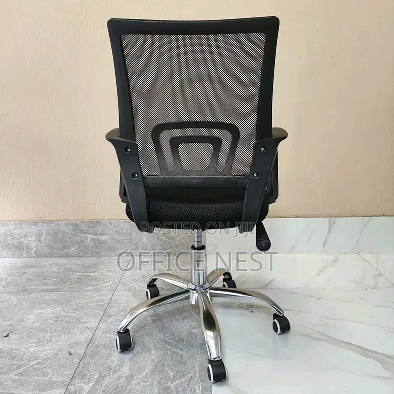 Ergonomic Mesh Office Chair With Adjustable Height Wheels.