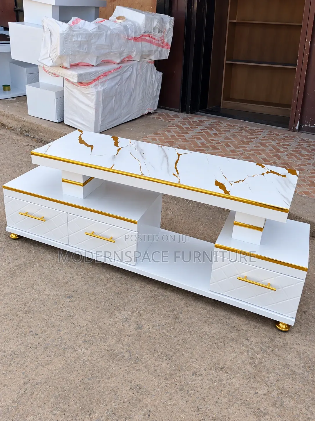 Stylish White TV Console With Gold Handles