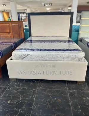 5 by 6 Cream Upholstered Bed