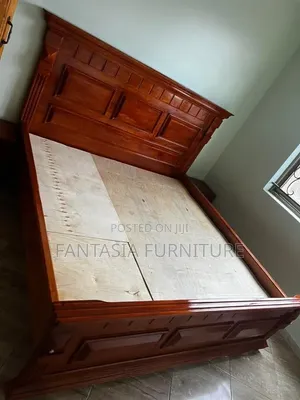 5 by 6 Brown Wooden Bed
