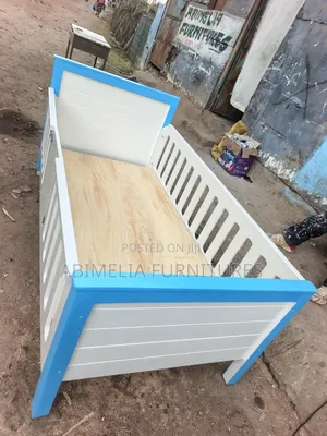 White and Blue Toddler Bed
