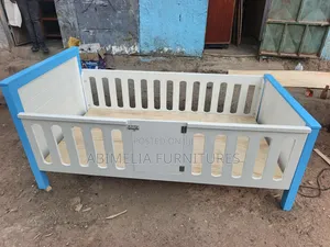 White and Blue Toddler Bed