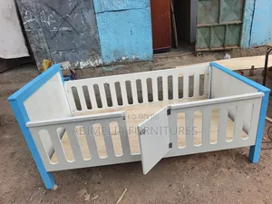 White and Blue Toddler Bed