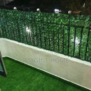 Relaxing Outdoor Space With Green Fences/Grass Carpet