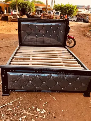 5 by 6 Black Upholstered Bed.