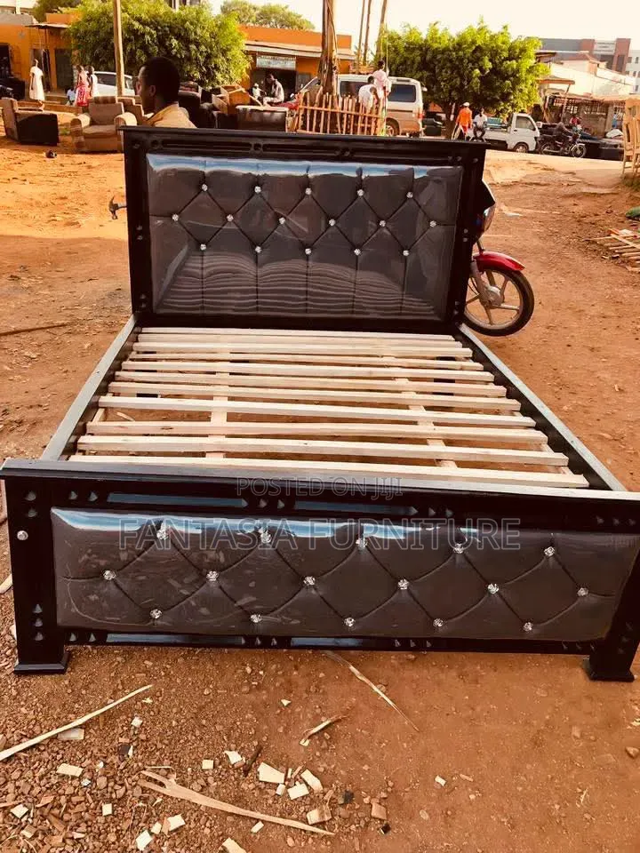 5 by 6 Black Upholstered Bed.