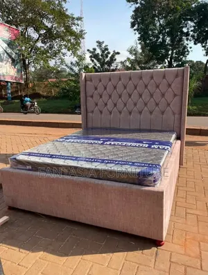 5 by 6 Pink Upholstered Bed.