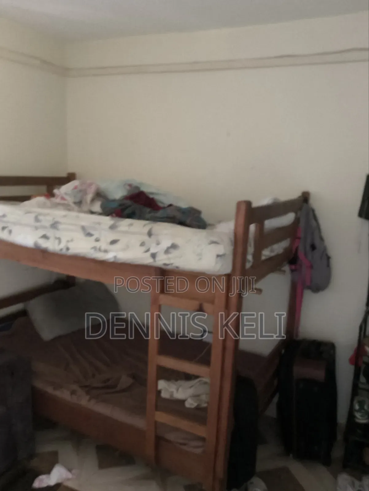 Doubledecker Bed Brown in colour.It's 3 and Half by 5 .Strong Material