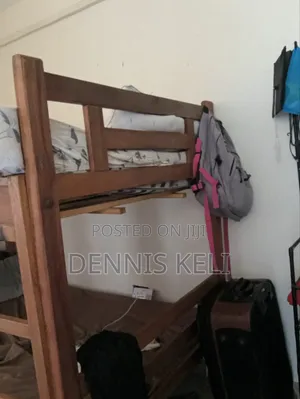 Doubledecker Bed Brown in colour.It's 3 and Half by 5 .Strong Material