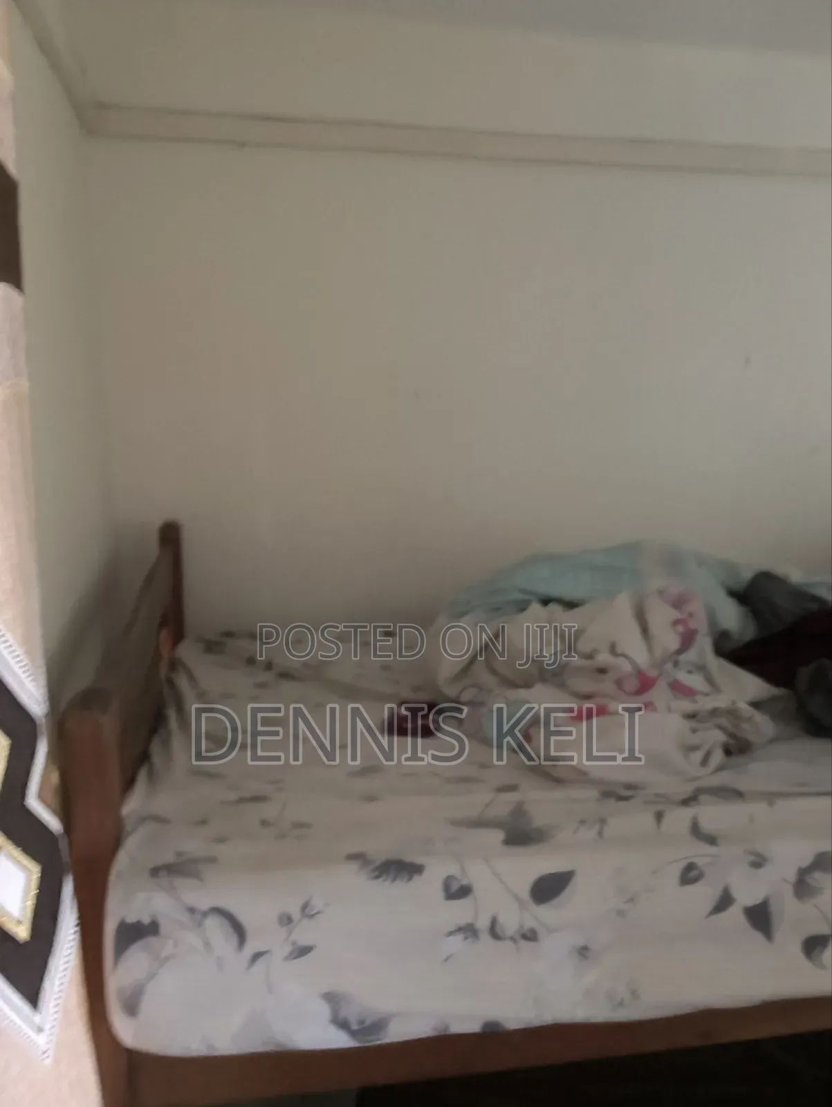 Doubledecker Bed Brown in colour.It's 3 and Half by 5 .Strong Material