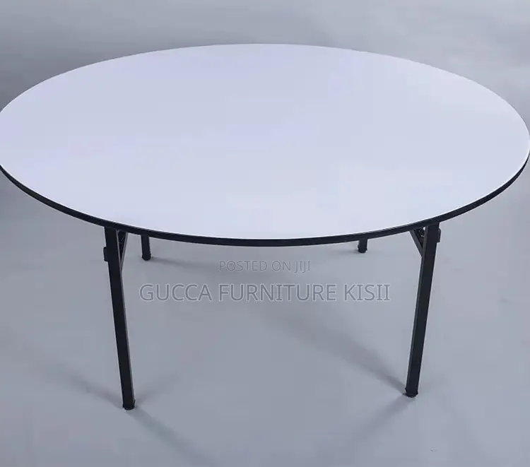 Round Foldable Table With Foldable Metallic Legs.