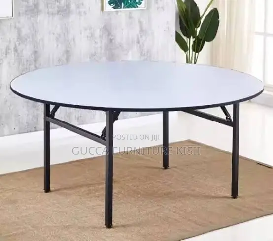 Round Foldable Table With Foldable Metallic Legs.